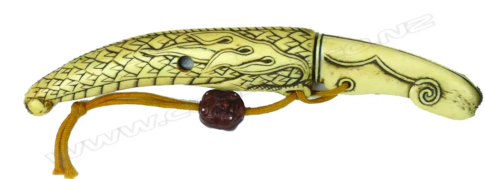 An unusual bone netsuke fashioned as a small knife Image 1++
