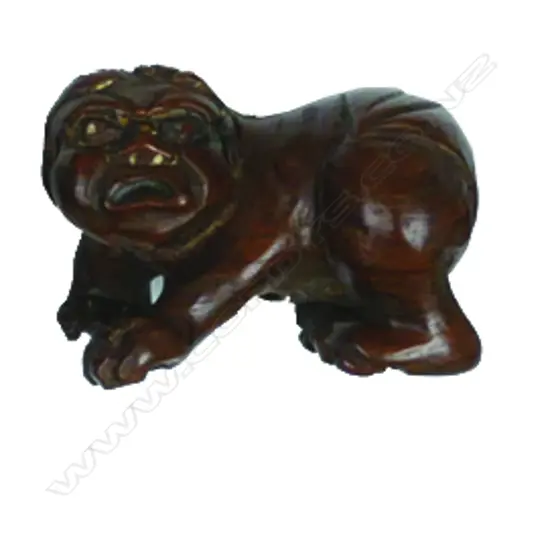 A boxwood netsuke of an child oni (demon)