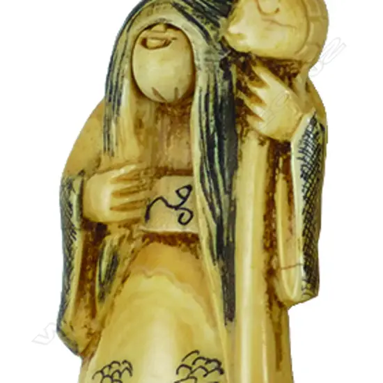 An old Japanese carved ivory karakuri netsuke