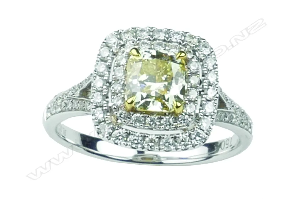 A lady's modern 18ct. white gold fancy yellow diamond cluster ring Image 1++