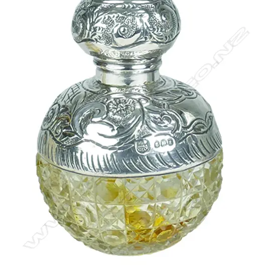 An Edwardian silver and cut crystal spherical scent bottle