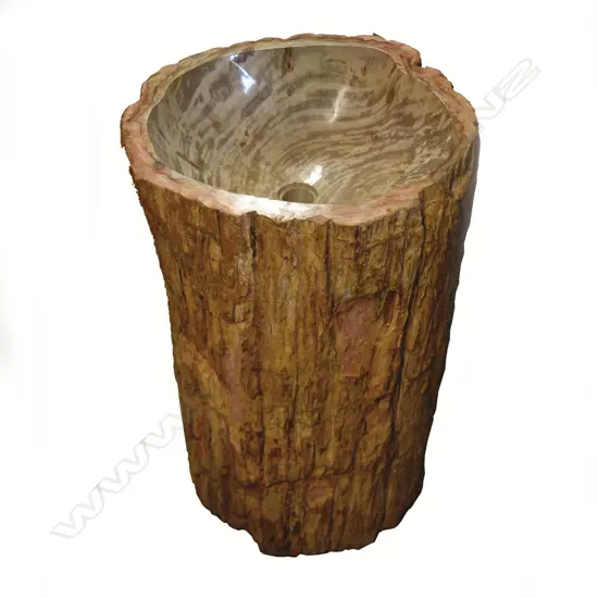 A tall and heavy petrified wood trunk section hand basin