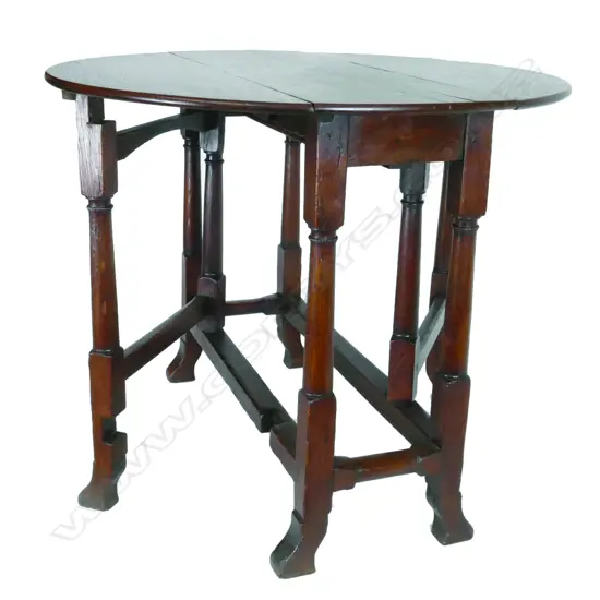 A small antique English oak gate leg table
