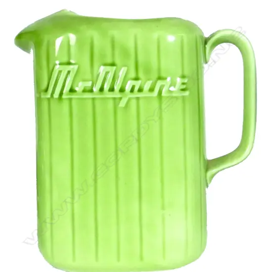 A Crown Lynn 'McAlpine' green glazed fridge jug