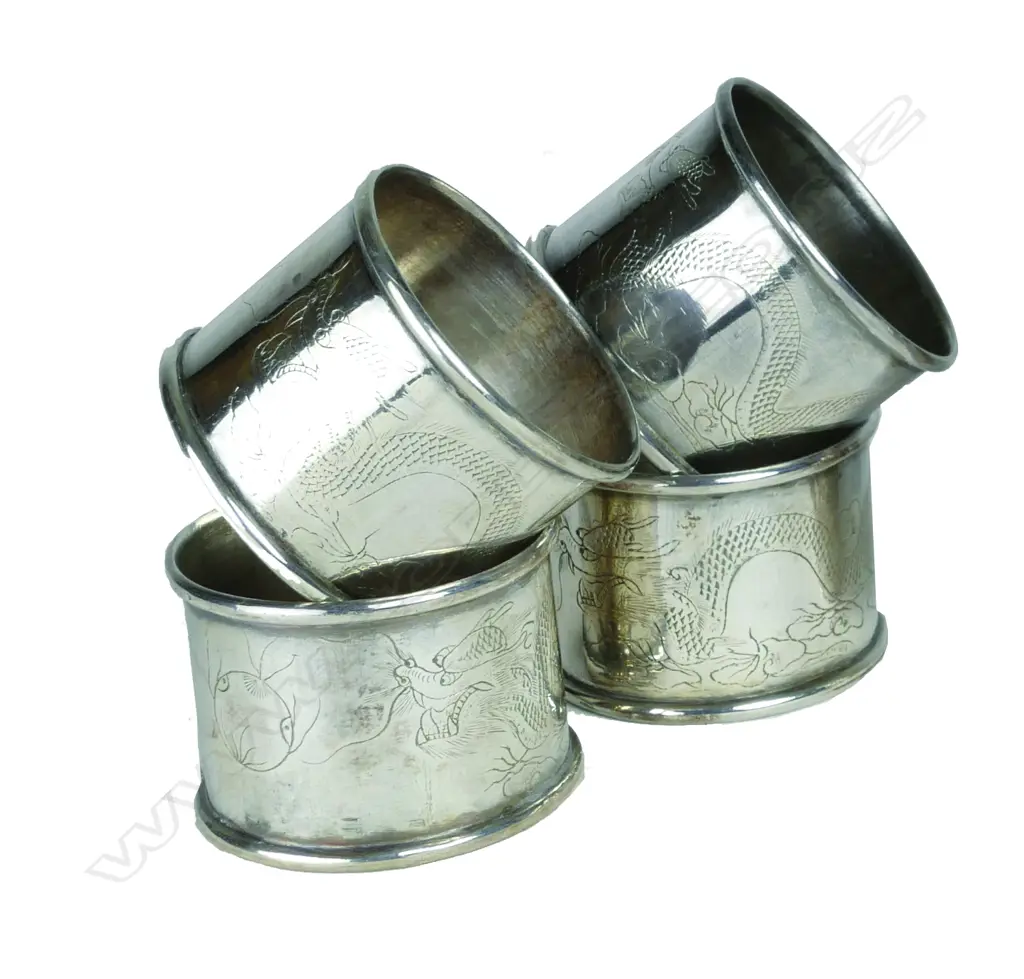 A set of four matching Chinese silver napkin rings Image 1++