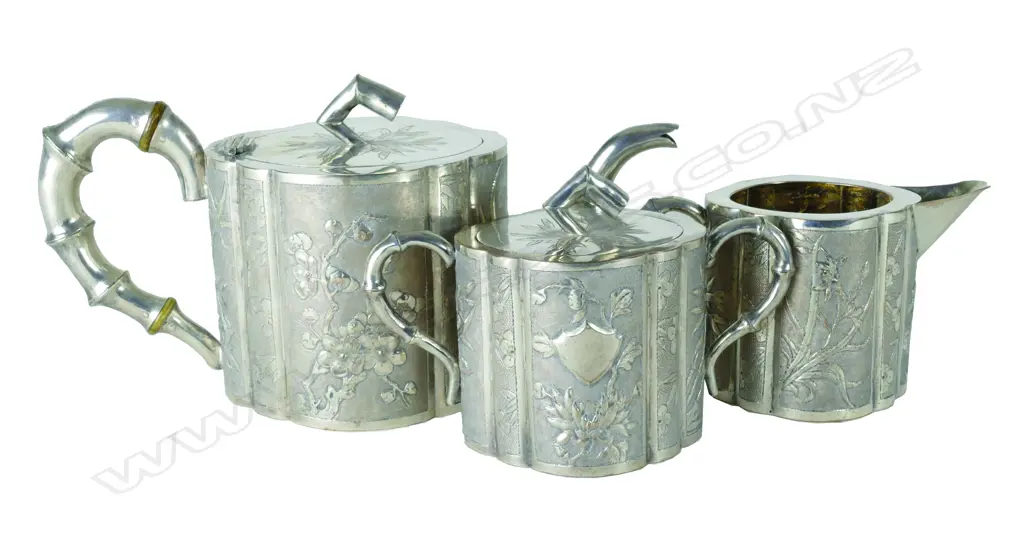 A late 19thC Chinese silver three piece tea set Image 1++