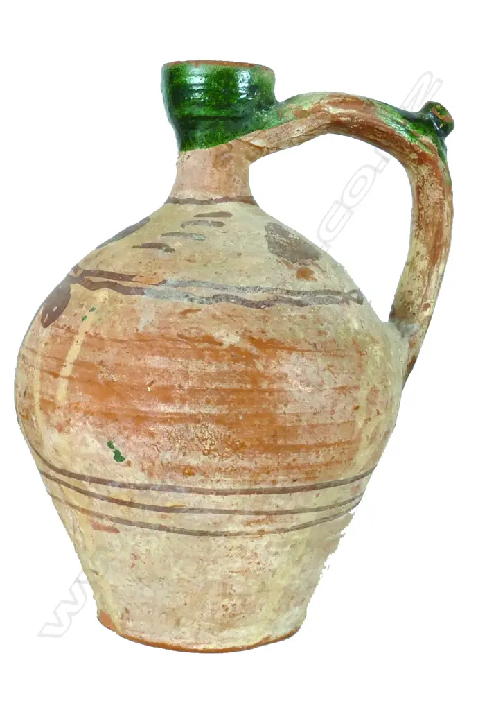 A large archaic earthenware pottery jug Image 1++