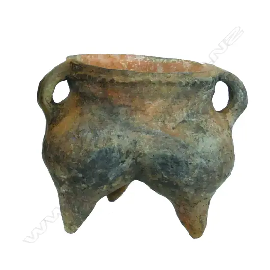 A small archaic earthenware tripod vessel