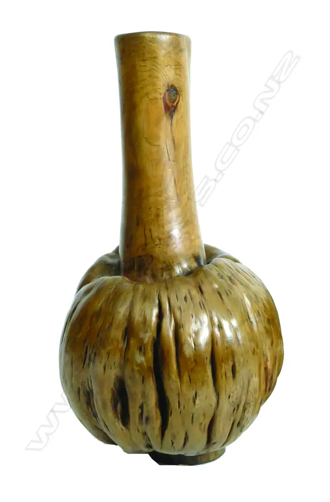 A timber vase made from the naturally swollen bol or burr of a small tree Image 1++