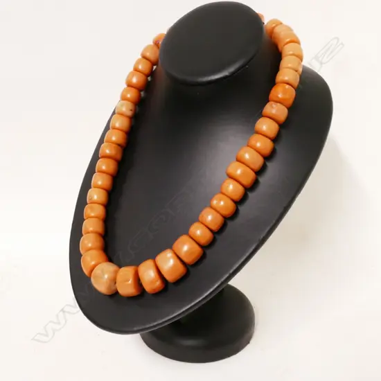 A vintage strand of 44 natural light reddish pink toned coral beads