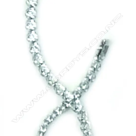 A lady's modern 18ct. white gold and diamond tennis bracelet