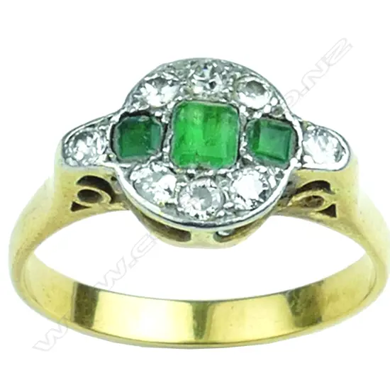 An Art Deco lady's 18ct. emerald and diamond cluster ring