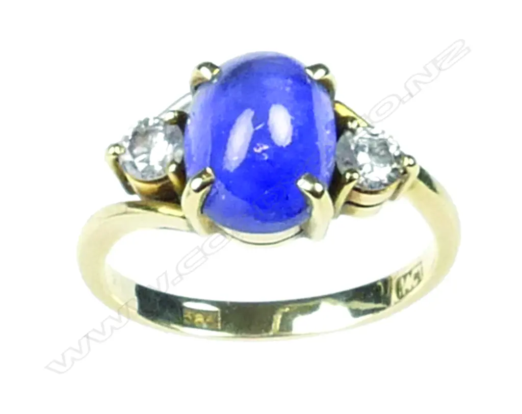 A 14ct. gold star sapphire and diamond ring Image 1++