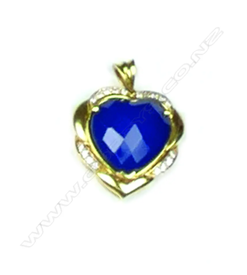 A lady's 18ct. yellow gold dyed blue quartz and diamond set pendant Image 1++