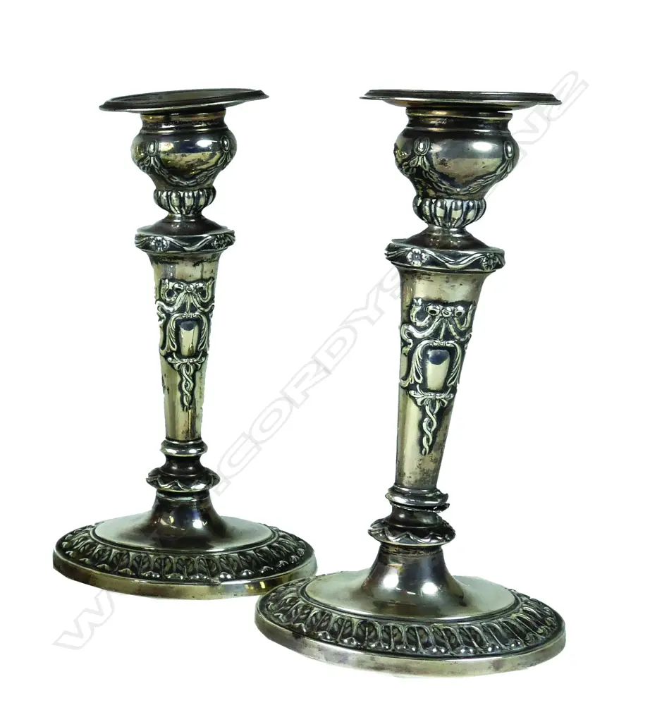 A pair of small Edwardian period silver candlesticks Image 1++