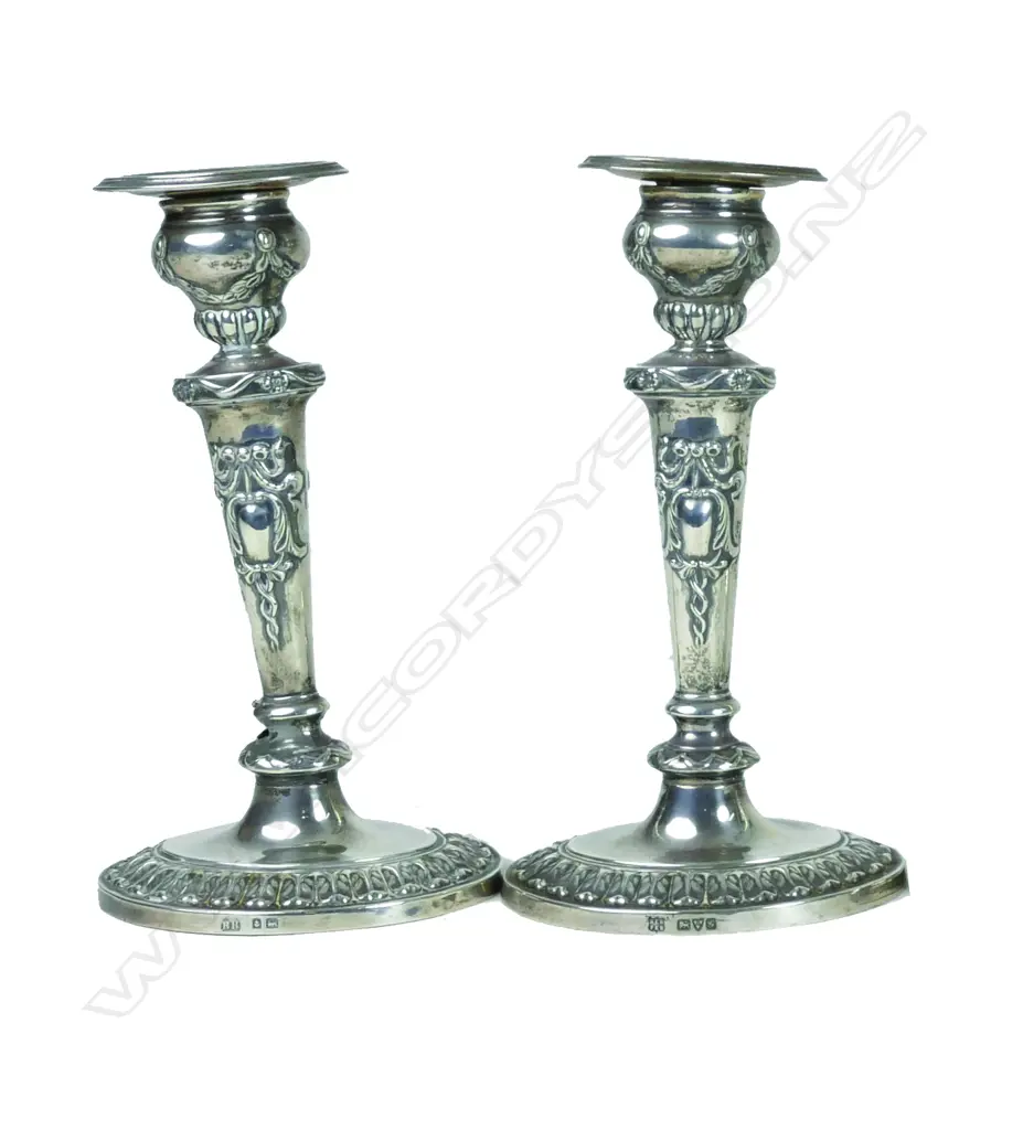 A pair of small Edwardian period silver candlesticks Image 1++