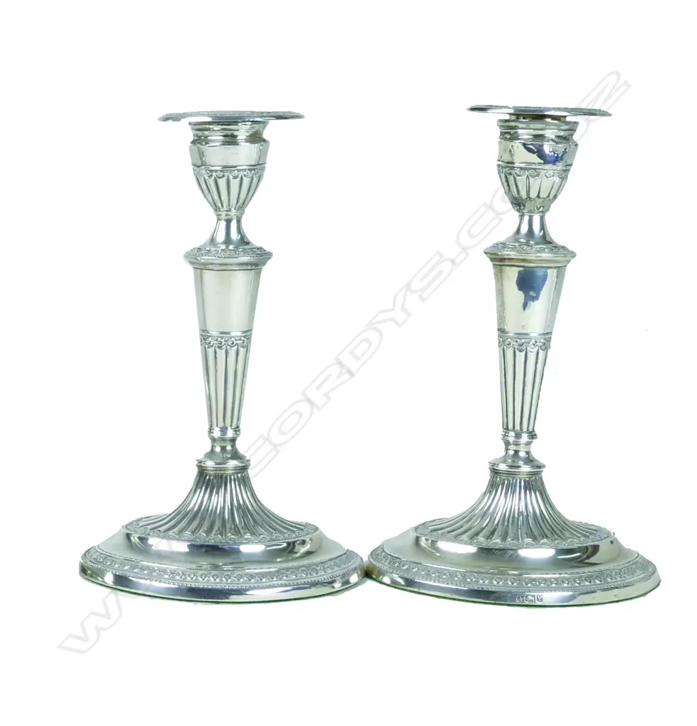 A pair of Victorian silver candlesticks Image 1++