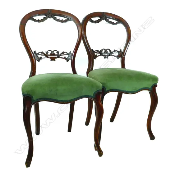 A set of six Victorian walnut framed balloon back chairs