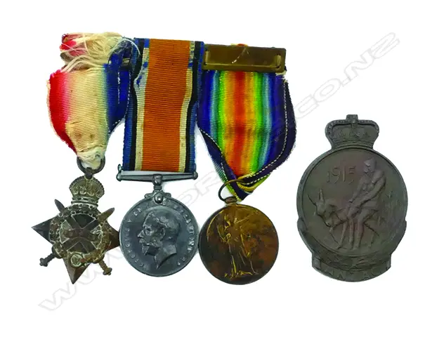A WWI three medal group and 1915 ANZAC bronze plaque awarded to: '2458COMS. N.M. Watchorn. 4BN. A.I.F.' Image 1++