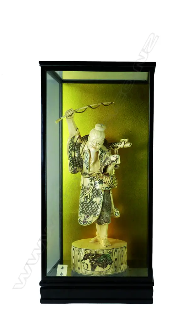 A large Japanese sectional bone carving of a fisherman Image 1++