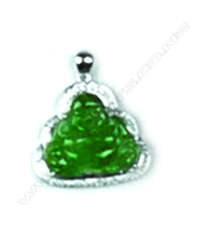 An 18ct. white gold diamond and jade Buddha pendant Image 1++