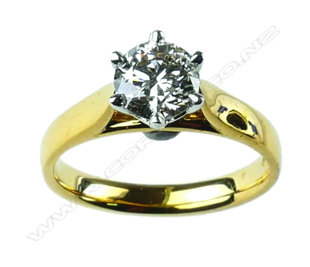 An 18ct gold and diamond solitaire ring Image 1++