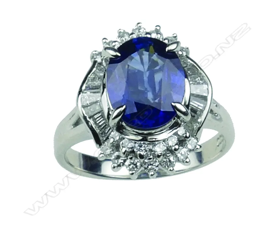 A modern lady's platinum sapphire and diamond cluster ring Image 1++