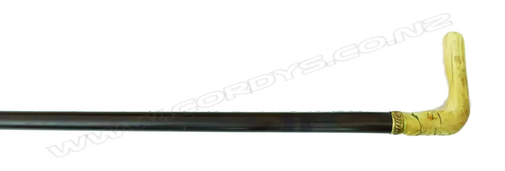 An ivory handled and rosewood walking cane Image 1++