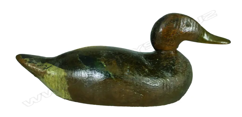 An early 20thC carved and painted wood duck decoy Image 1++