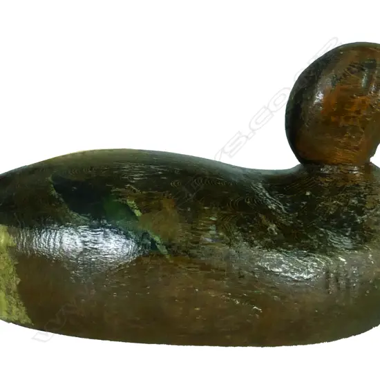 An early 20thC carved and painted wood duck decoy