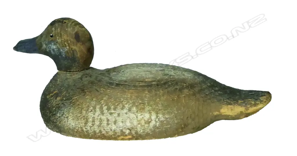 An early 20thC carved and painted wood duck decoy Image 1++