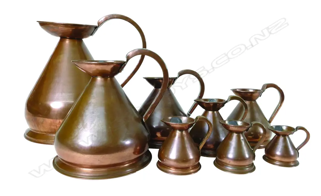 A set of ten 19thC copper measure jugs Image 1++