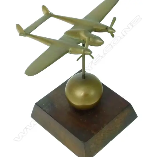 A brass model of a WWII Lockheed Lightning P-38 long range fighter
