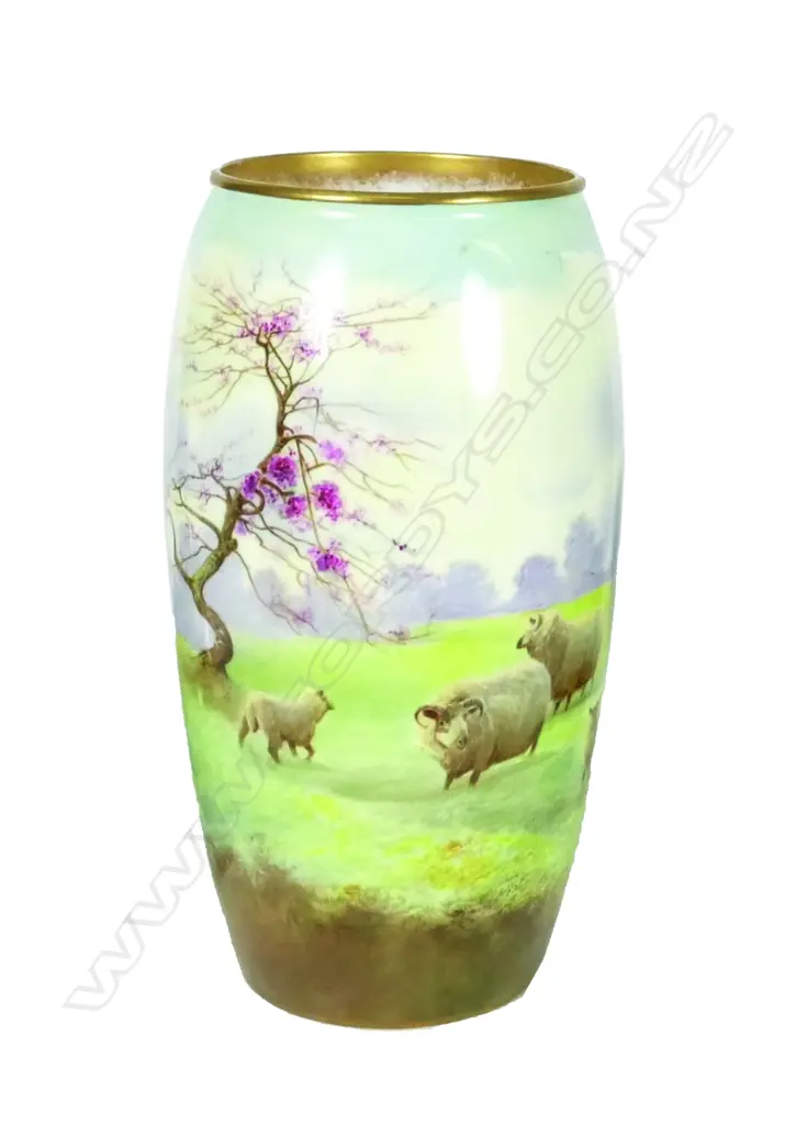 A Royal Doulton vase decorated with sheep in an extensive landscape Image 1++