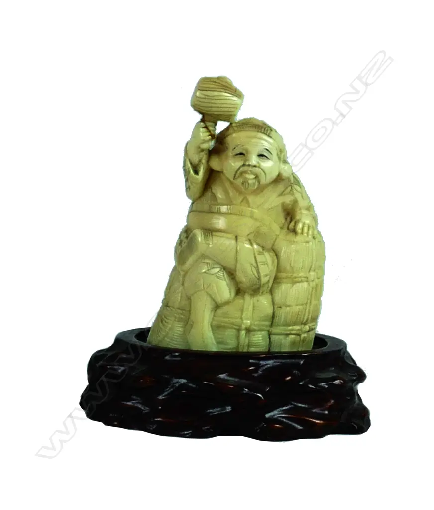 A Japanese ivory carving of Daikoku Image 1++