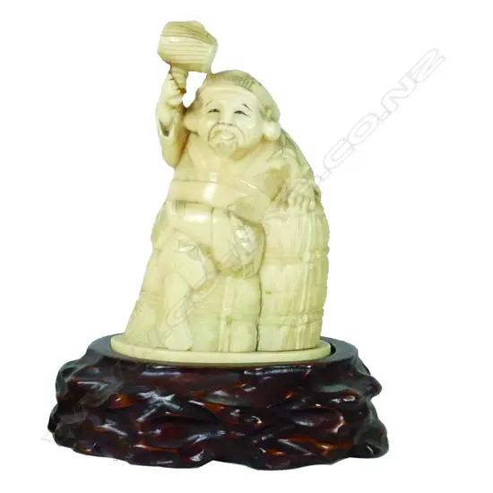 A Japanese ivory carving of Daikoku