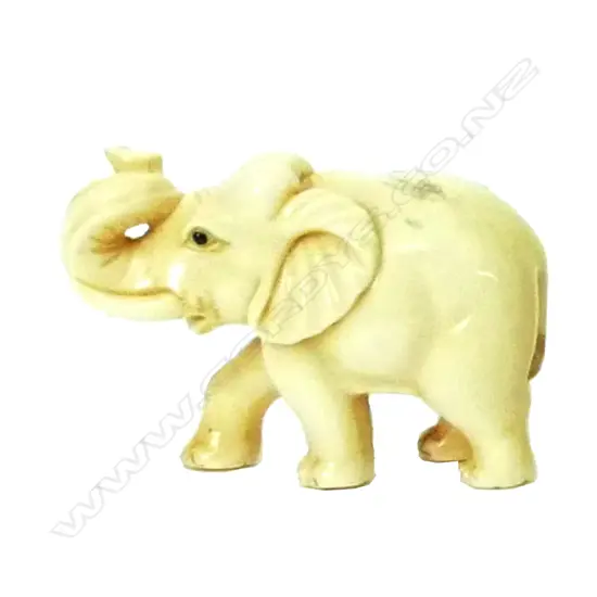 A Japanese ivory netsuke of an elephant with trunk raised