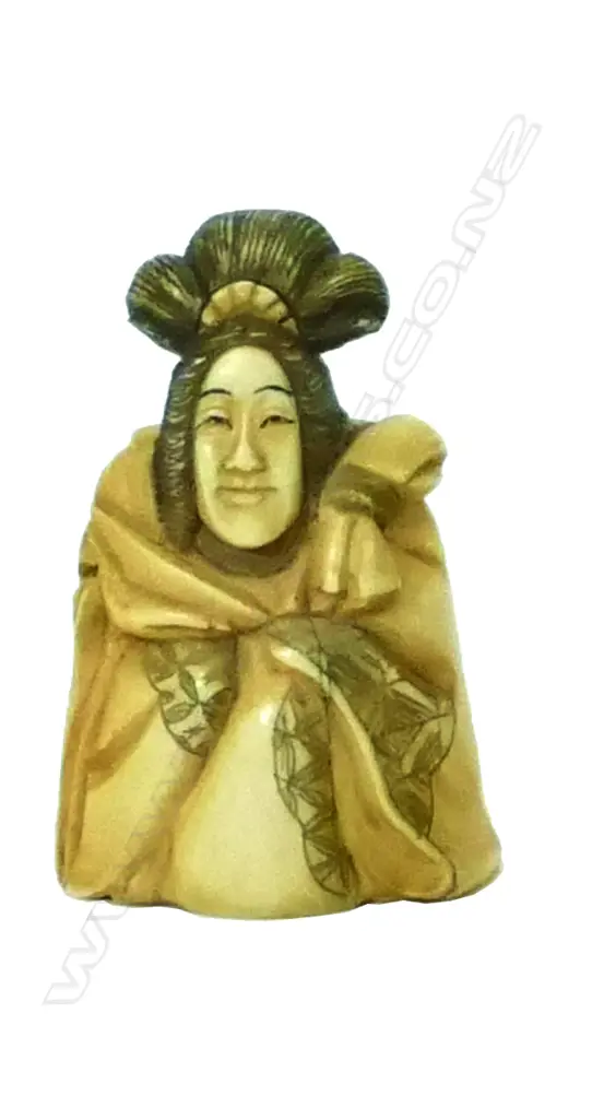 A carved ivory netsuke of the Japanese female deity Benten Image 1++