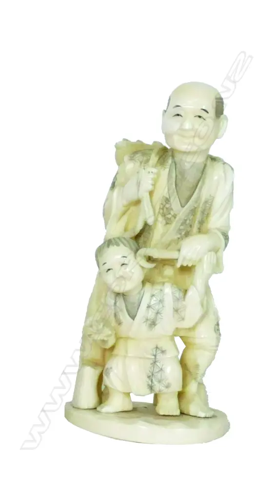 A Japanese marine ivory carving of a peasant gatherer and child.  Their garments engraved with diaper patterns Image 1++