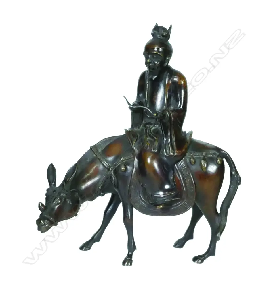 An Oriental bronze statuette of the immortal Zhang Guo-lao riding a mule Image 1++