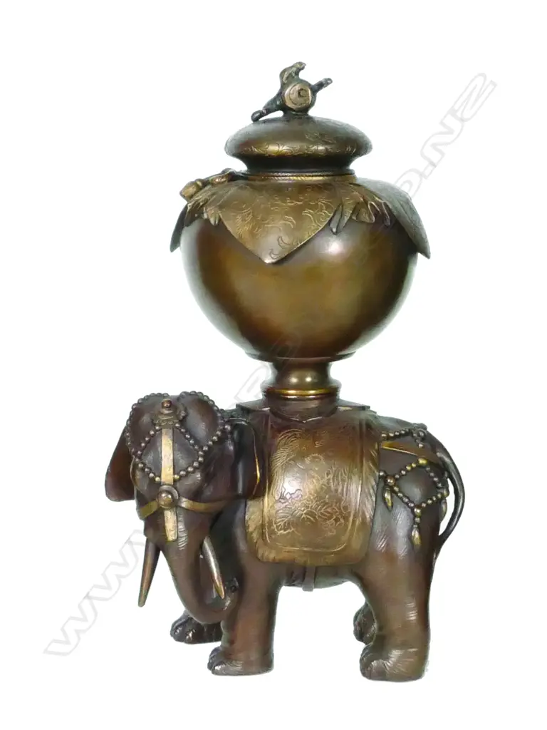 An Oriental bronze vase on elephant stand Image 1++