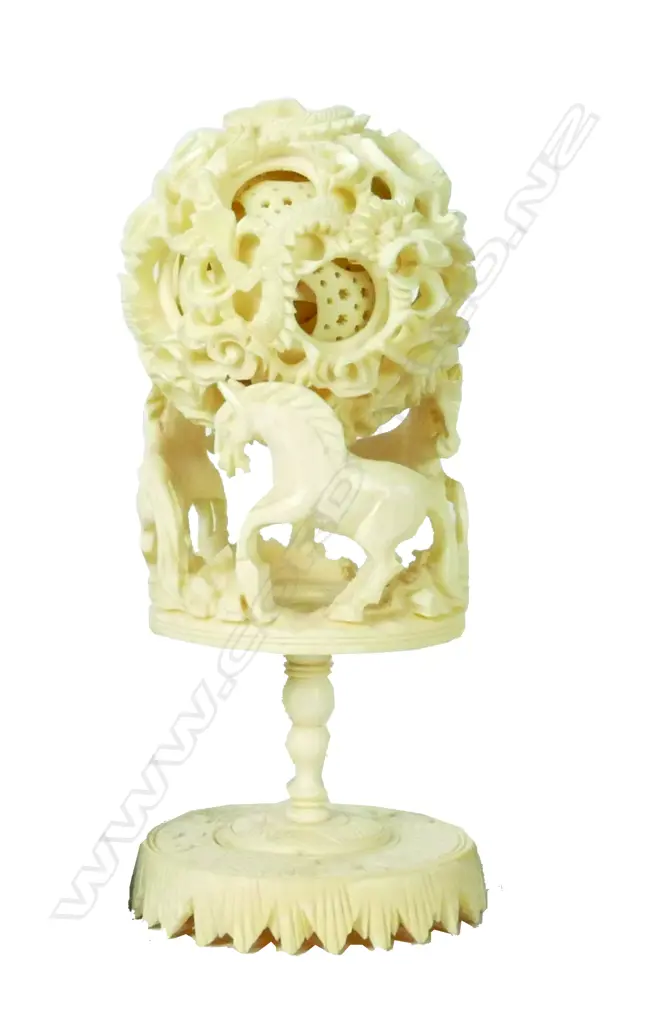 A Chinese carved ivory puzzle ball on stand Image 1++