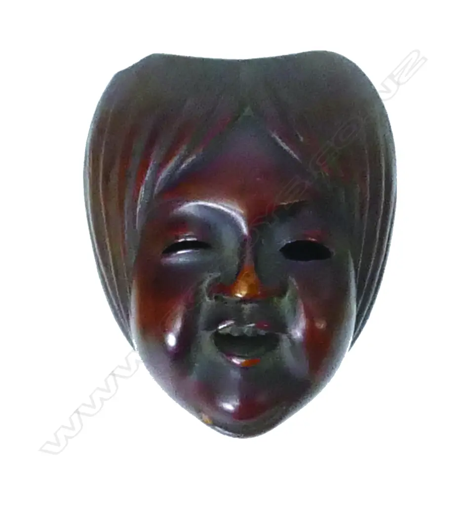 A miniature finely carved wood mask/toggle Image 1++