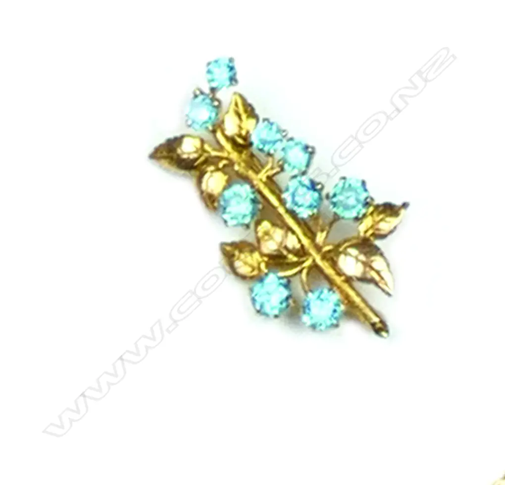 A 9ct gold and blue zircon brooch Image 1++