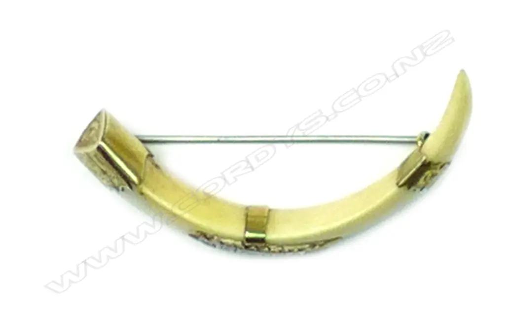 A N.Z. colonial 'Kia-Ora' 9ct. gold and boar tusk brooch Image 1++