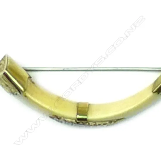 A N.Z. colonial 'Kia-Ora' 9ct. gold and boar tusk brooch