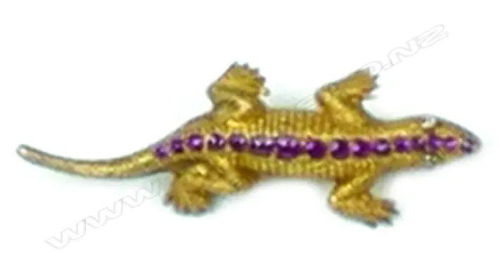 An early 20thC 18ct. gilded yellow gold ruby and diamond lizard form brooch Image 1++