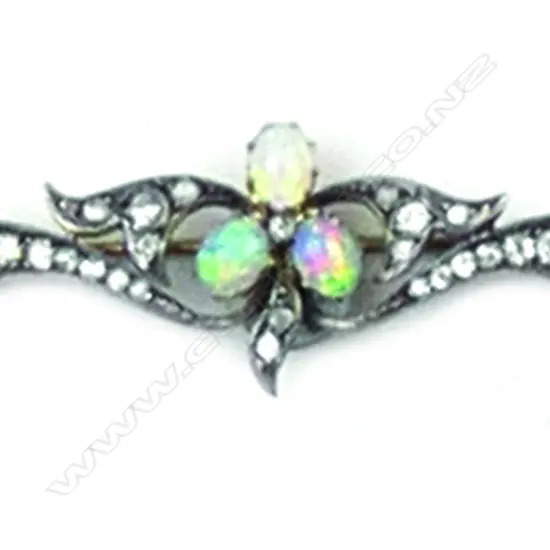 A c.1900 silver gilt opal and diamond brooch