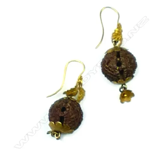 A pair of Victorian gilded gold and carved nut earrings