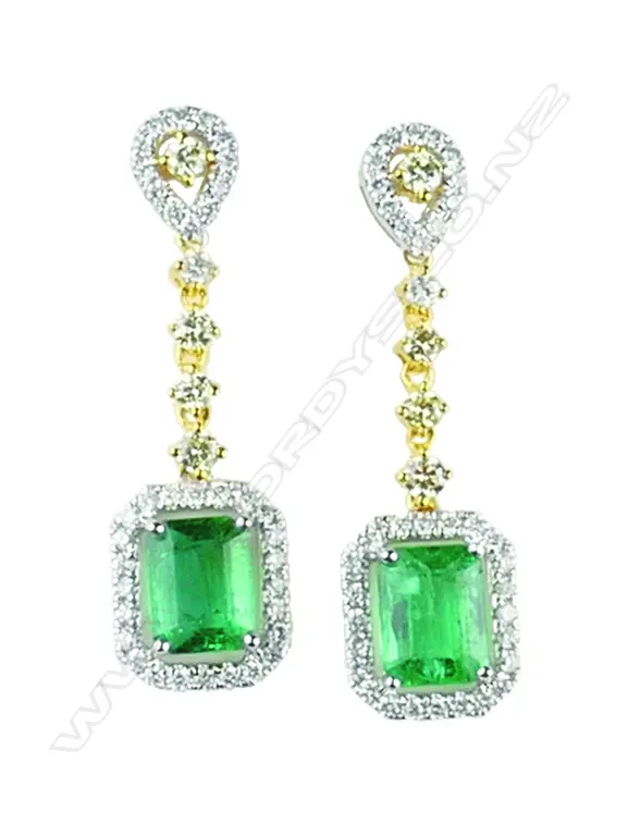 An elegant pair of 18ct yellow and white gold emerald and diamond earrings Image 1++